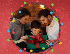 an image of a white family with mom, dad and their boy child opening his Christmas present with Christmas lights surrounding them in circle