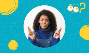 a feature sized image for the blog "Should I Text Him? How To Know What To Do" on a bright blue background with dotted texture. A black woman with a smirkng face wearing jumper jeans with a blue sweater inside while both hands on her shoulder level keeping fingers crossed. Yellow graphic circles surrounding her.
