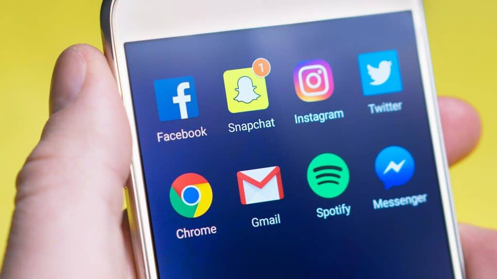 a photo of a smartphone showing social media accounts